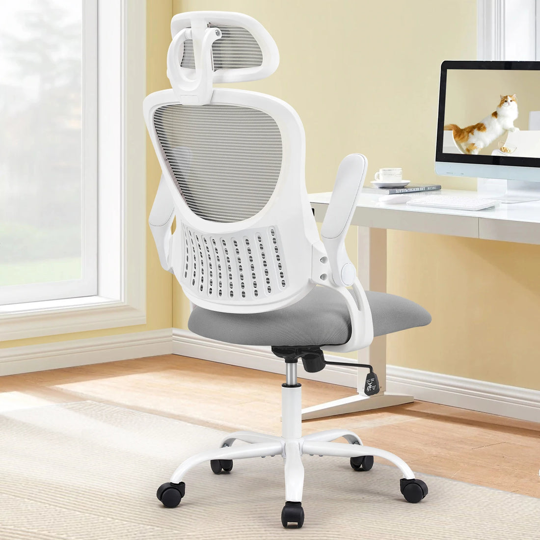 Black Ergonomic Mesh Office Chair with Flip-Up Arms